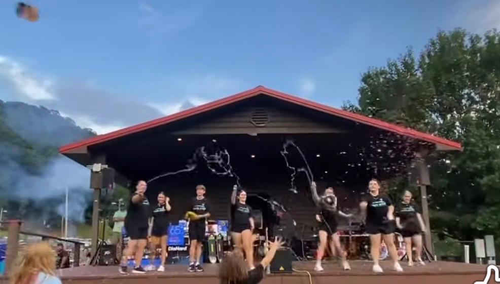 Youth gathered beneath a pavilion at a group event