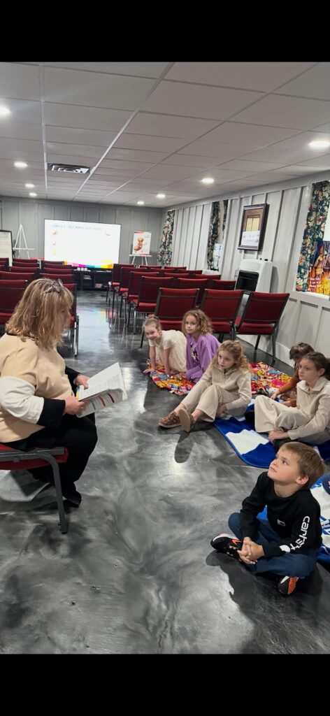 Children’s Church gathering in the fellowship hall
