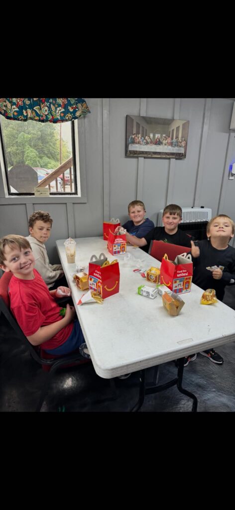 Children gathered around a table in the fellowship hall