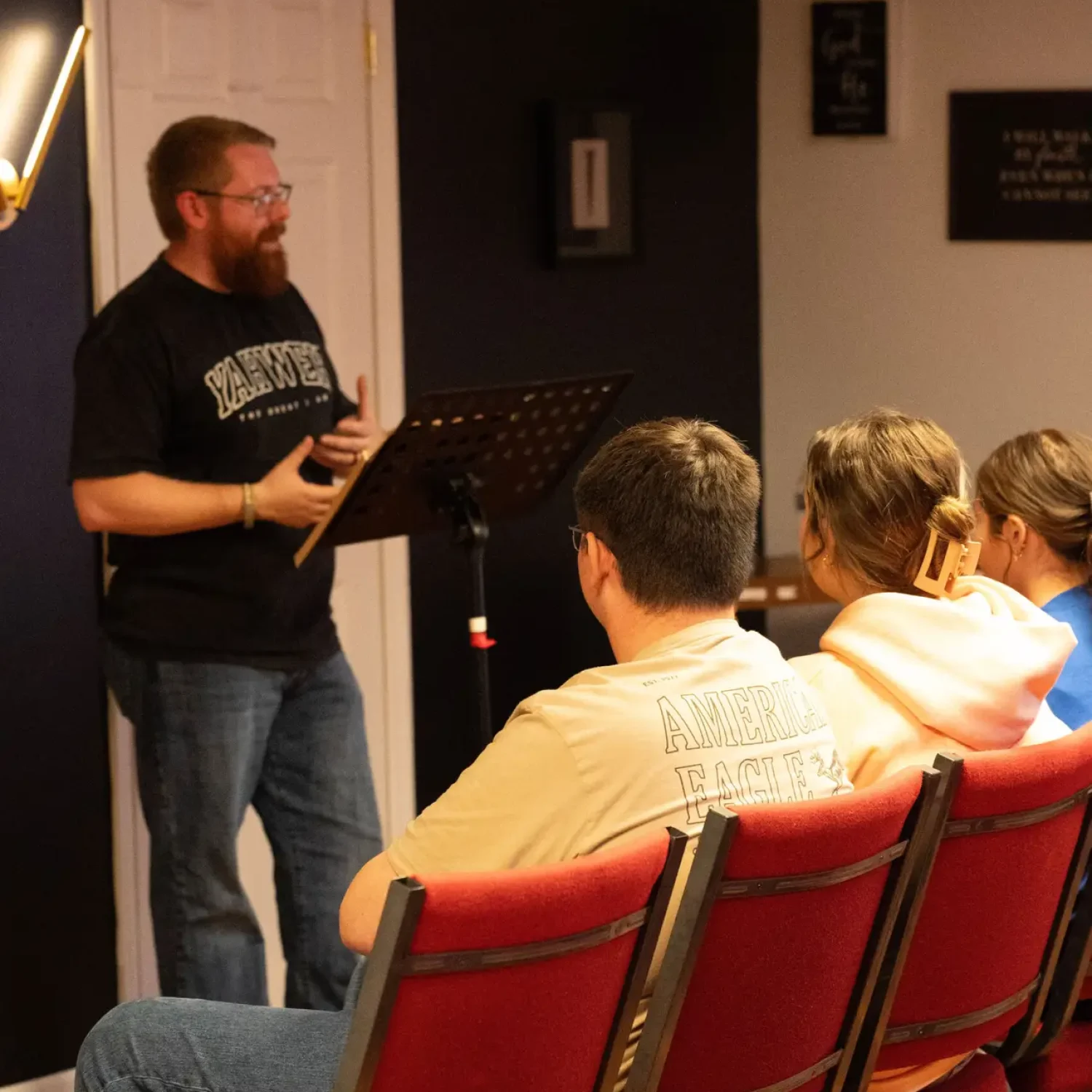 Youth leader teaching students seated in the Element 412 classroom